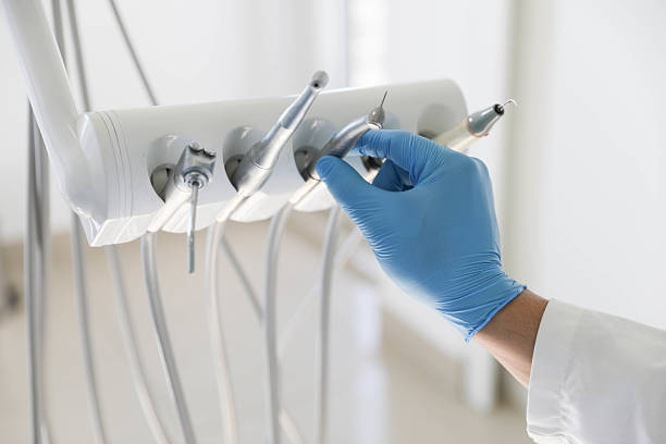 Professional Tooth Extraction technician working in Indian River, MI